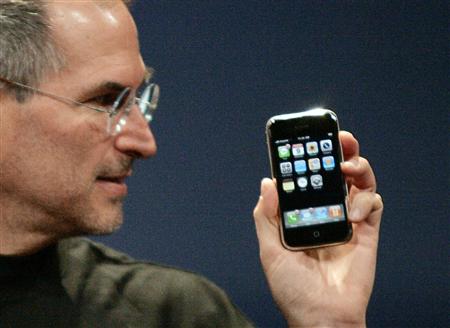 Steve Jobs holding iPhone